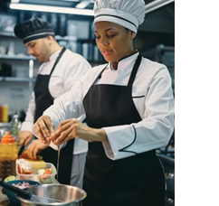 Two chefs in a kitchen, one of them is a woman. AI generated content
