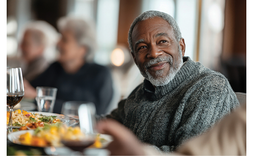 A man is sitting at a table with a plate of food in front of him. AI generated content