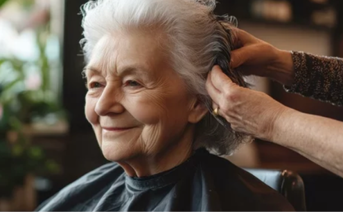 A woman is sitting in a chair with a hairdresser brushing her hair. AI generated content